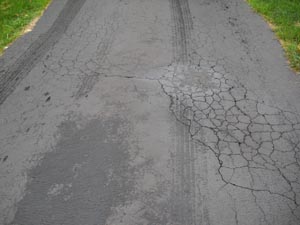 Spiderweb asphalt driveway cracks